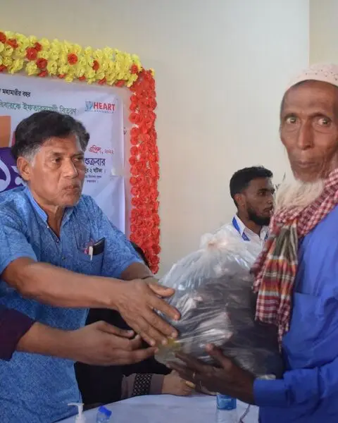 HEART team handing over relief to an elderly man